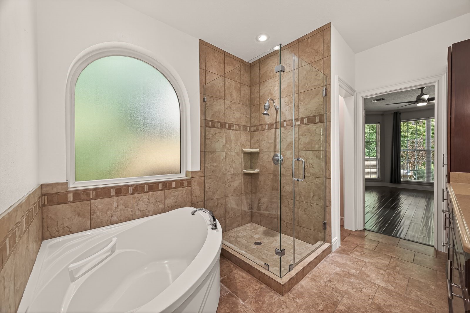 6131 Hampton Way Court Spring, TX 77389 - Photo 38 of 50 a bathroom with a bathtub and a shower