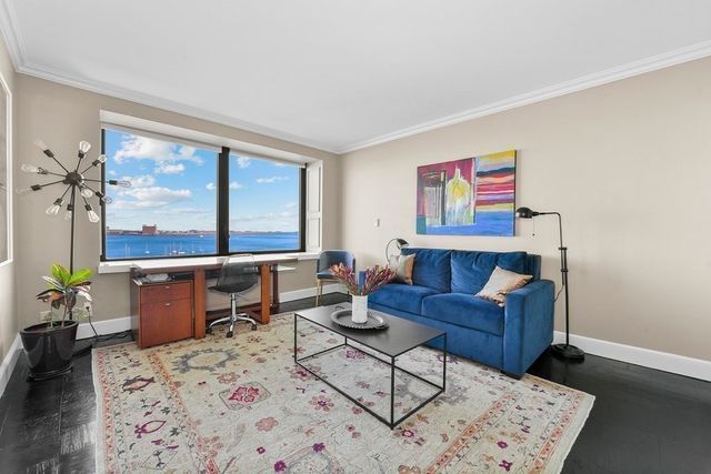 a bathroom with a granite countertop sink a mirror and a shower