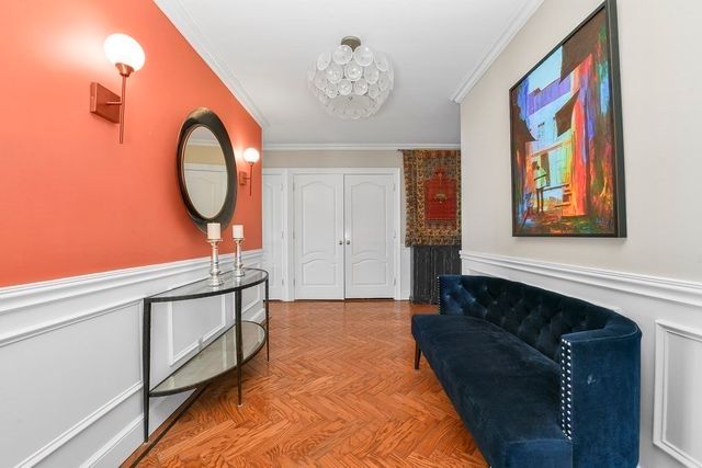 a bedroom with a large bed and a large window