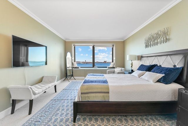 a bedroom with bed and a night stand