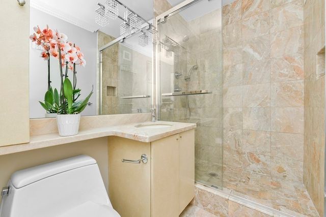 front view of a building with a garden