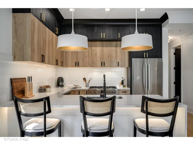 a kitchen with a table and chairs