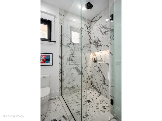 a bathroom with a shower and a sink