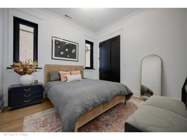 a bedroom with a bed and a television