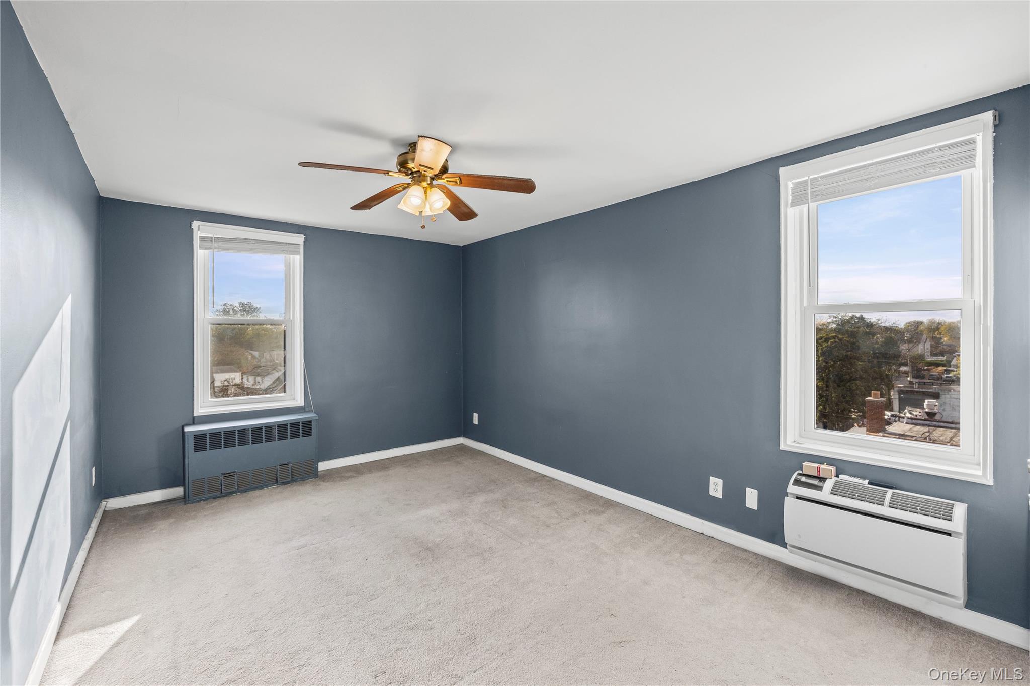 504 Merrick Road, Unit 4E Lynbrook, NY 11563 - Photo 14 of 19 a view of an empty room with a window