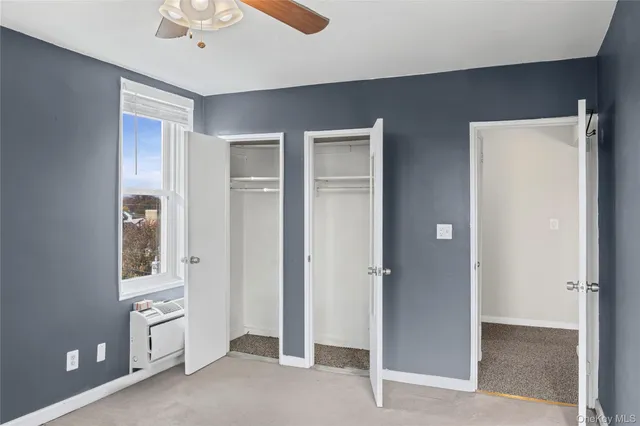 a view of a hallway with a bathroom