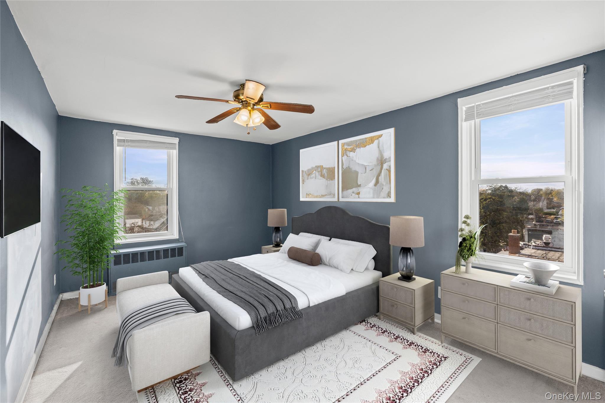 504 Merrick Road, Unit 4E Lynbrook, NY 11563 - Photo 16 of 19 a bedroom with a large bed and a window