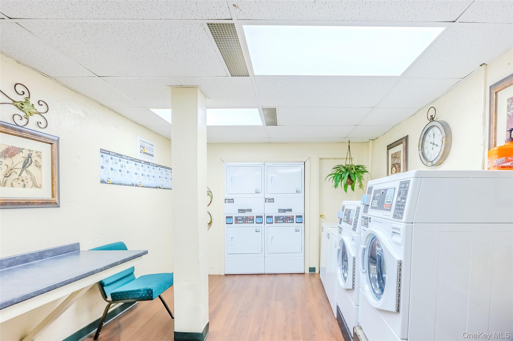 504 Merrick Road, Unit 4E Lynbrook, NY 11563 - Photo 18 of 19 a view of a hallway with furniture and wooden floor