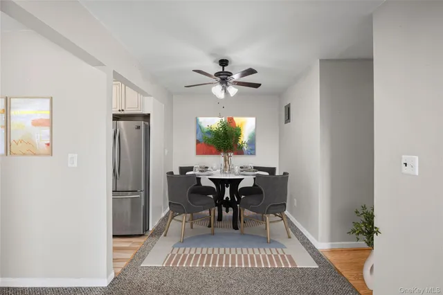 a view of a dining room with furniture and chandelier