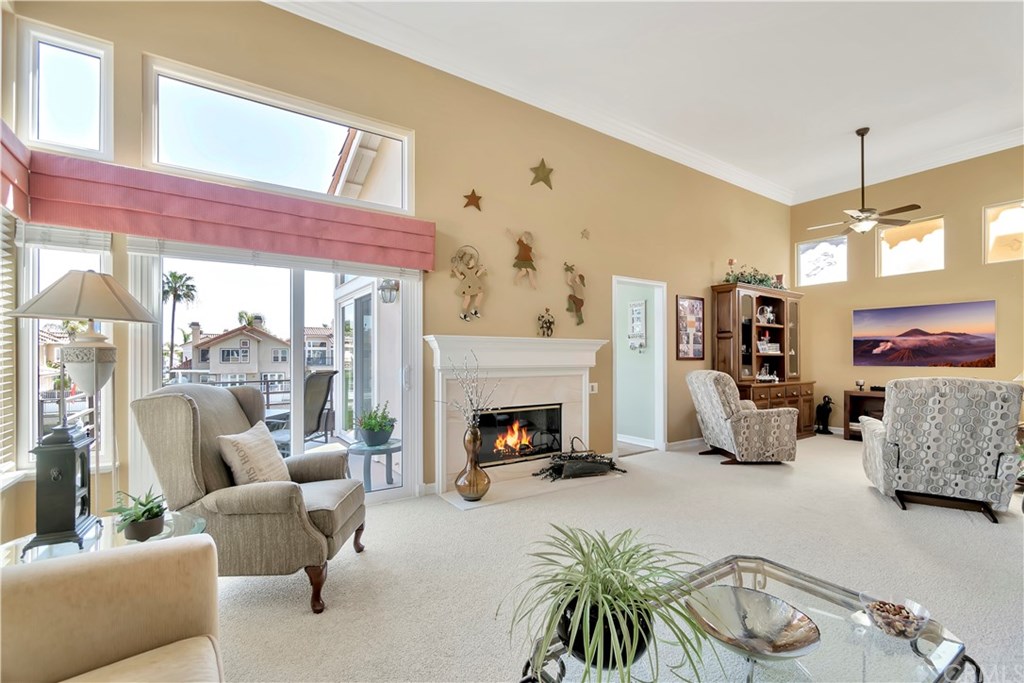 346 Long Long Beach, CA 90803 - Photo 3 of 24 Upper level living room with fireplace and access to balcony with water and greenbelt views.
