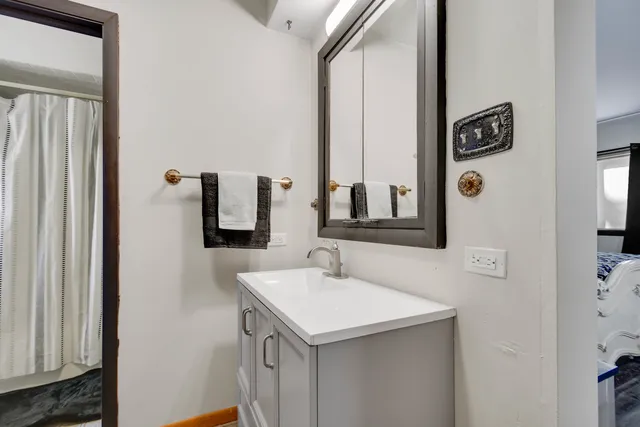 a bathroom with a sink and a mirror