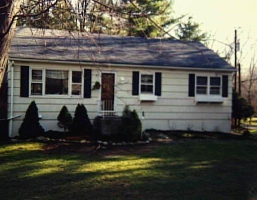 341 Bennetts Farm Road Ridgefield, CT 06877 - Photo 1 of 1 a front view of a house with a yard