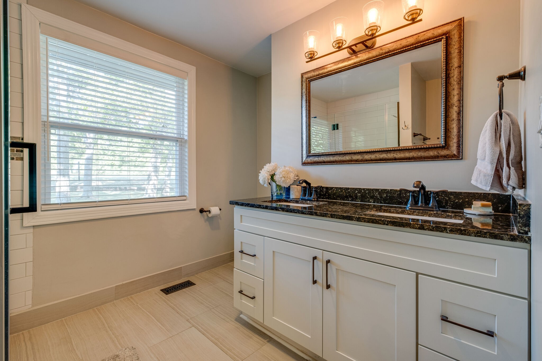 1012 Neelys Bend Road Madison, TN 37115 - Photo 18 of 38 a bathroom with a sink a vanity and a mirror