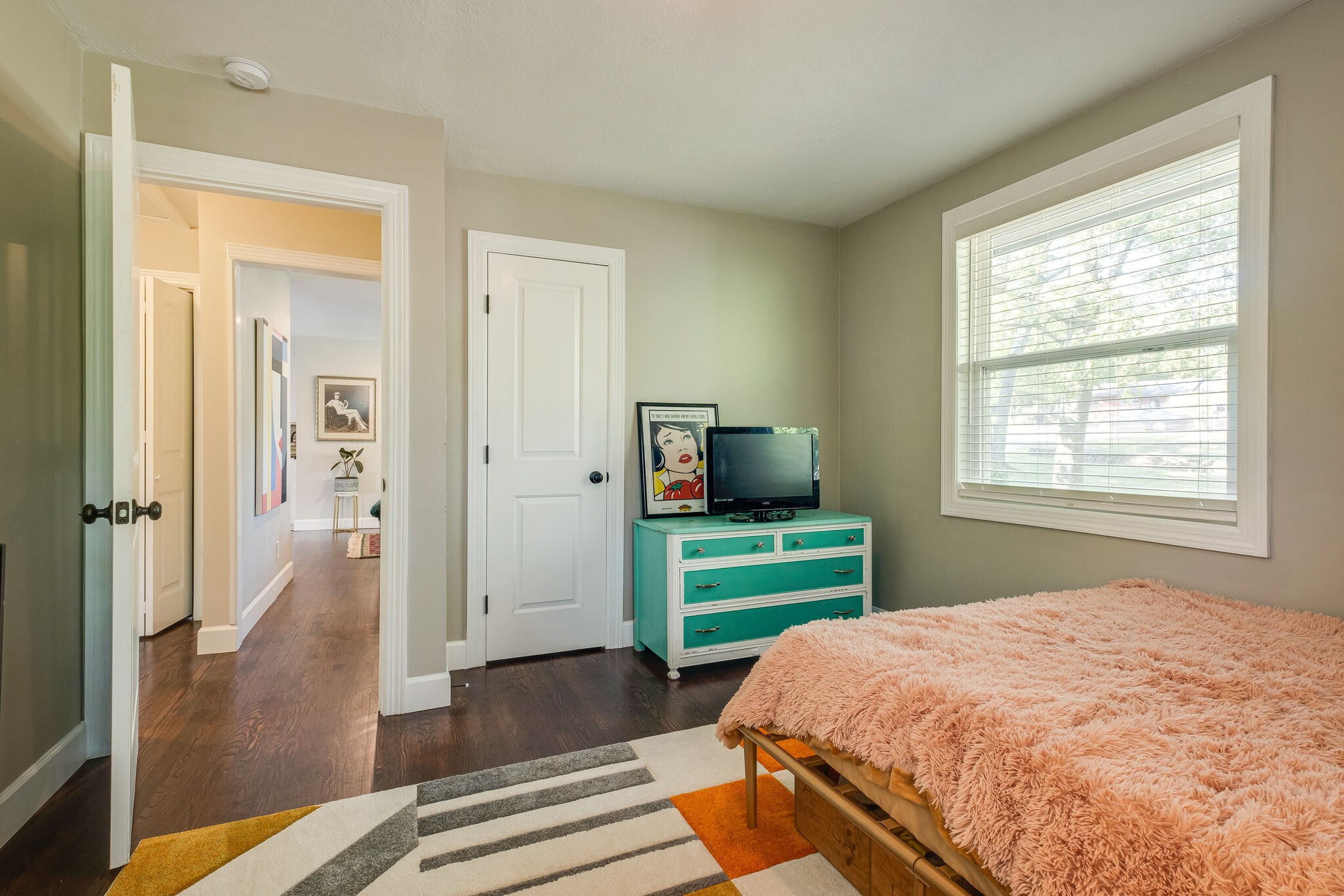 1012 Neelys Bend Road Madison, TN 37115 - Photo 20 of 38 a bedroom with a bed and a television