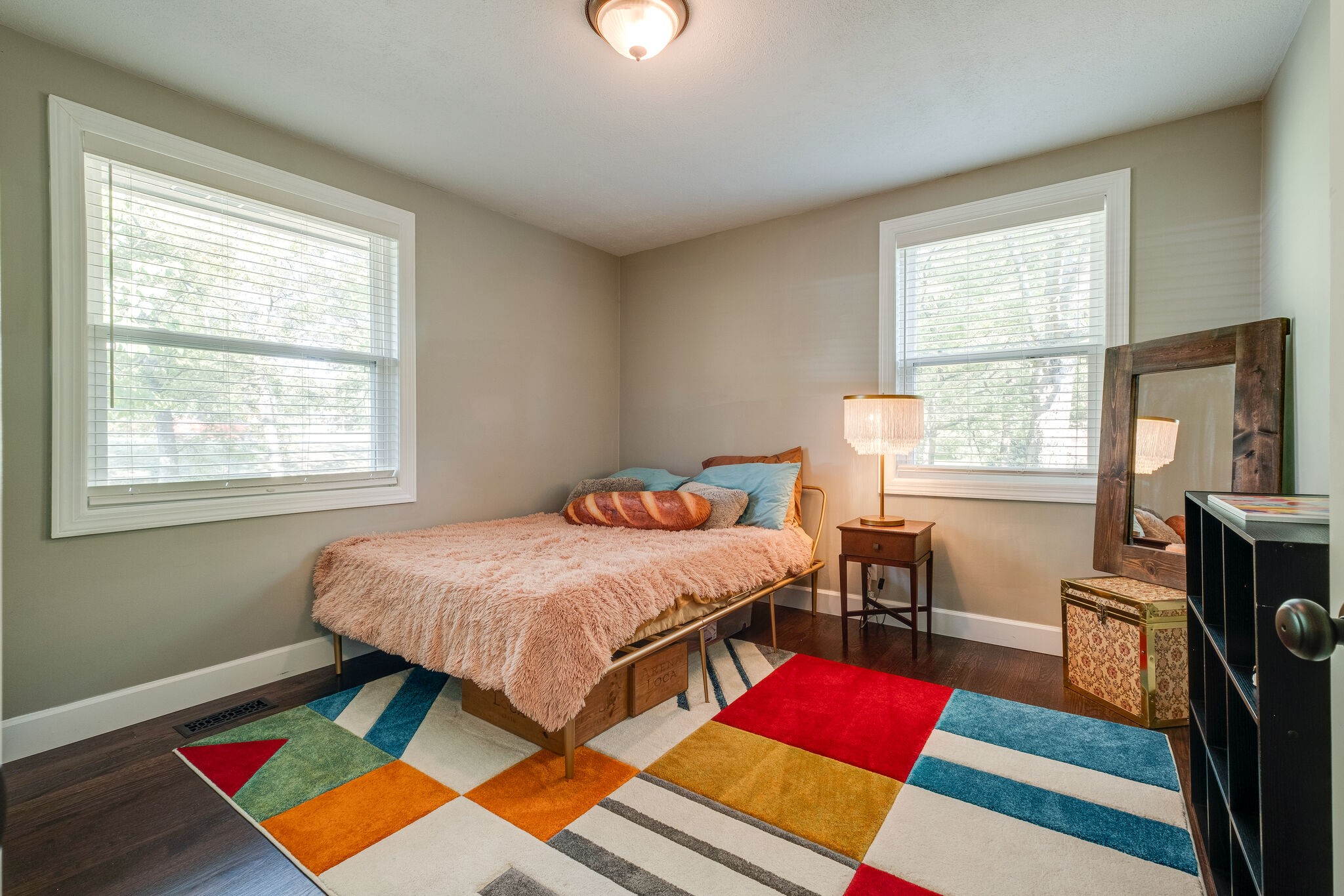 1012 Neelys Bend Road Madison, TN 37115 - Photo 21 of 38 a bedroom with a bed and wooden floor