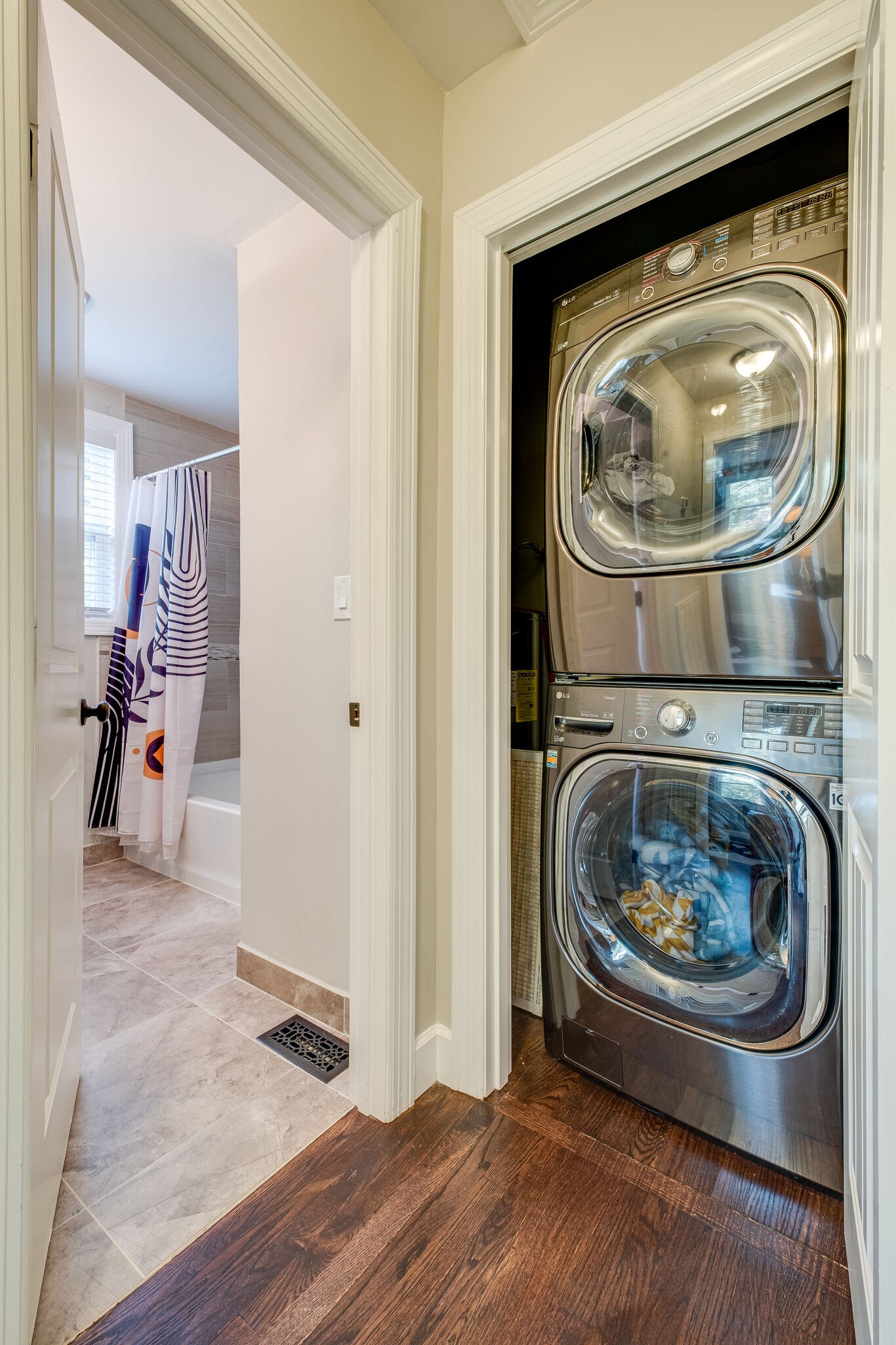 1012 Neelys Bend Road Madison, TN 37115 - Photo 23 of 38 a utility room with washing machine and a view of bedroom