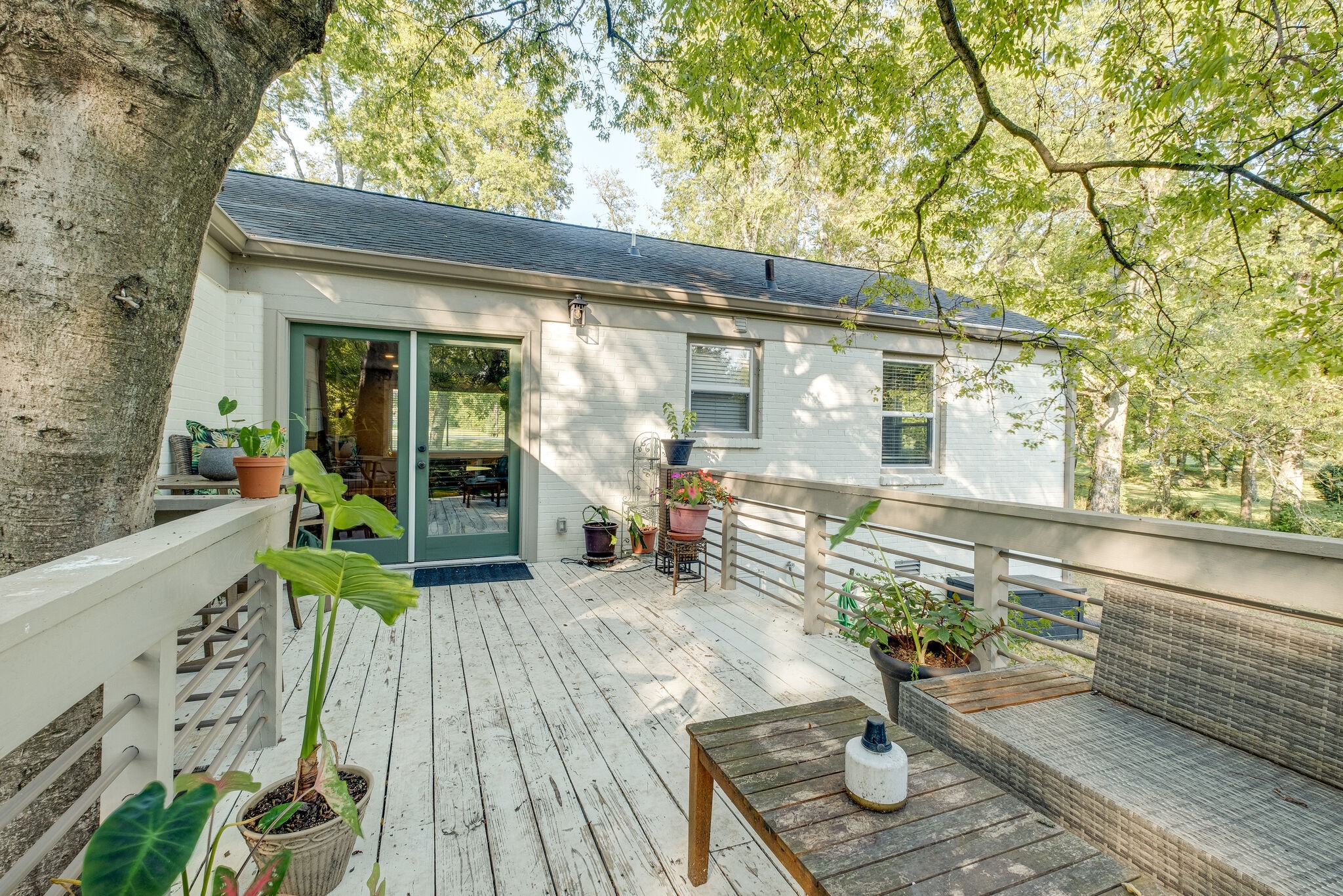 1012 Neelys Bend Road Madison, TN 37115 - Photo 26 of 38 a view of a patio with table and chairs and wooden floor