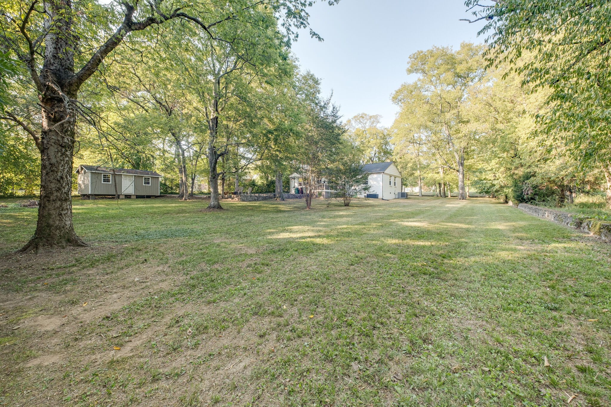 1012 Neelys Bend Road Madison, TN 37115 - Photo 32 of 38 a big yard with lots of green space and trees