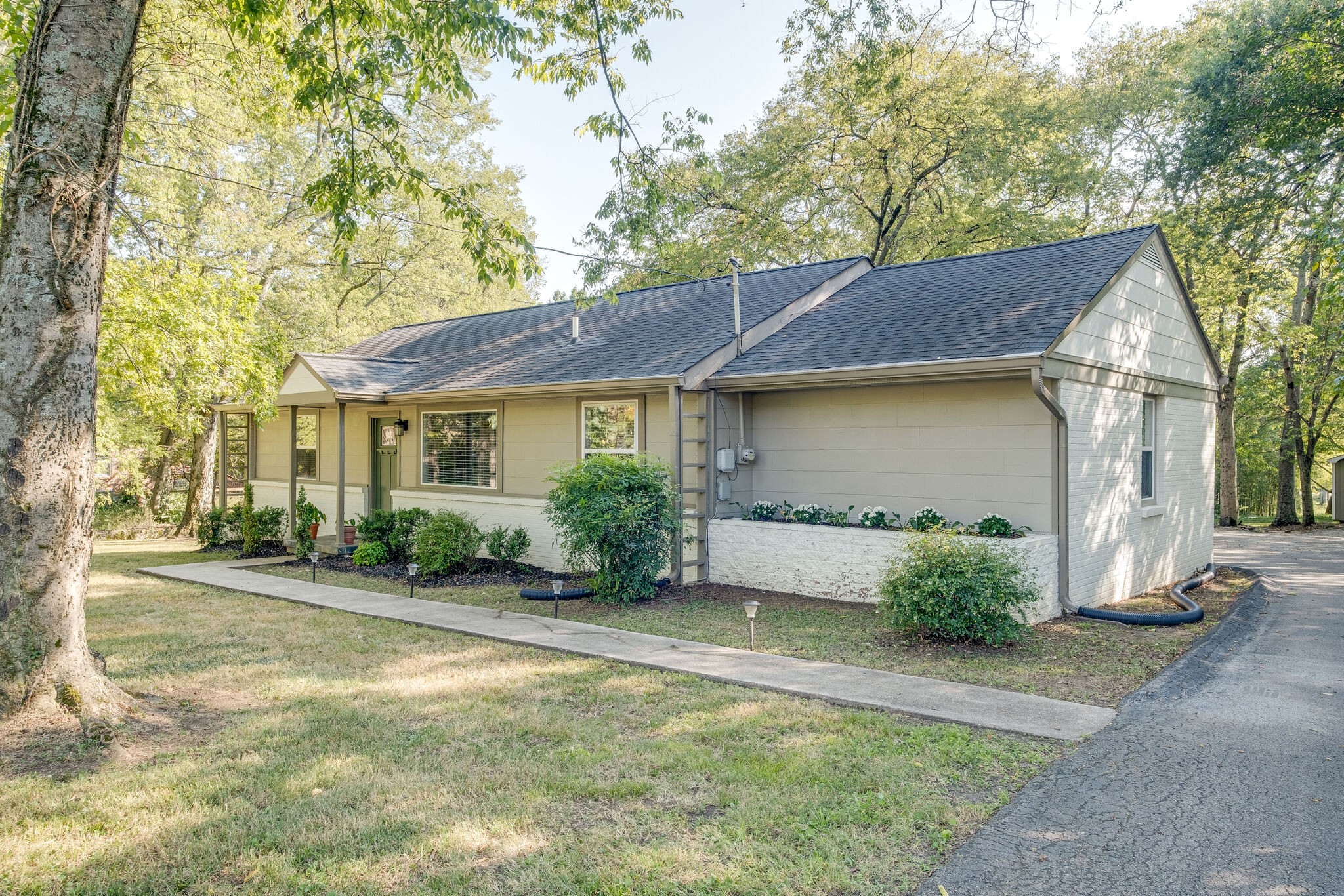 1012 Neelys Bend Road Madison, TN 37115 - Photo 4 of 38 a front view of a house with a yard and potted plants