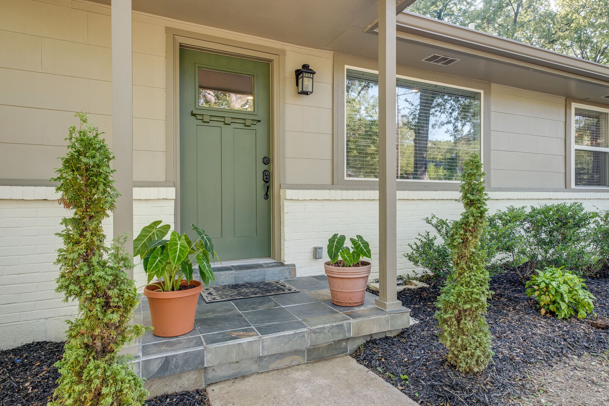 1012 Neelys Bend Road Madison, TN 37115 - Photo 6 of 38 a view of a entryway door of the house with potted plants
