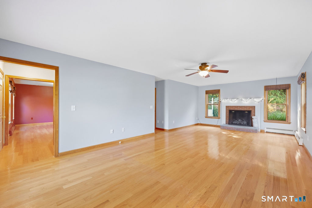 435 Old Slocum Road Hebron, CT 06231 - Photo 15 of 38 FRONT TO BACK WITH A GAS LOG FIREPLACE AS THE MAIN FEATURE OF THIS ROOM