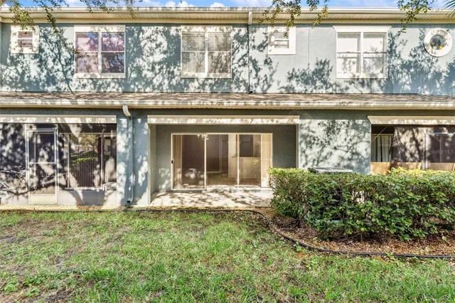 a view of a living room filled with furniture and a window