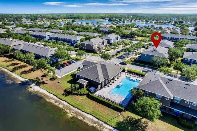 an aerial view of a house with a ocean view