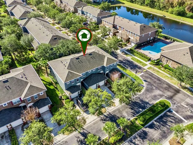 an aerial view of a house with a garden
