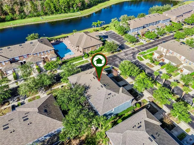 an aerial view of a house with a garden