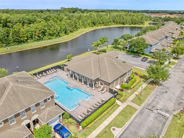 an aerial view of a house having swimming pool
