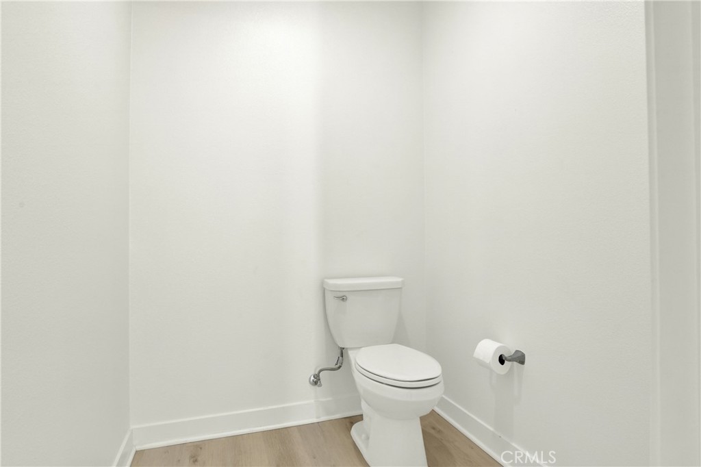 3715 Rivington Irvine, CA 92612 - Photo 26 of 65 a white toilet sitting next to a white cabinet