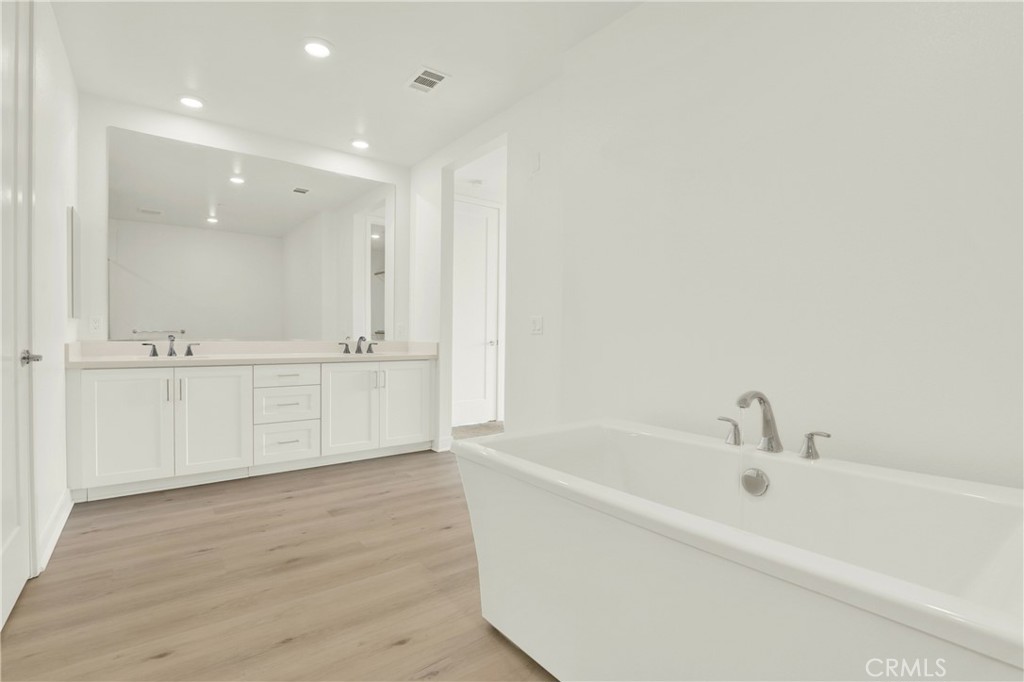 3715 Rivington Irvine, CA 92612 - Photo 27 of 65 a bathroom with a bathtub and a sink