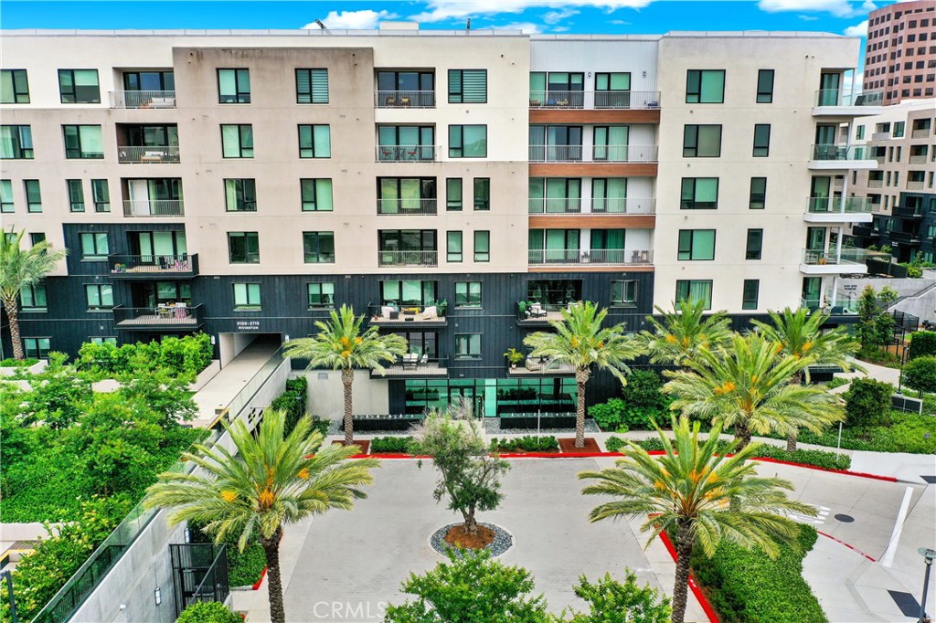 3715 Rivington Irvine, CA 92612 - Photo 40 of 65 a vase of flowers sitting in front of a building
