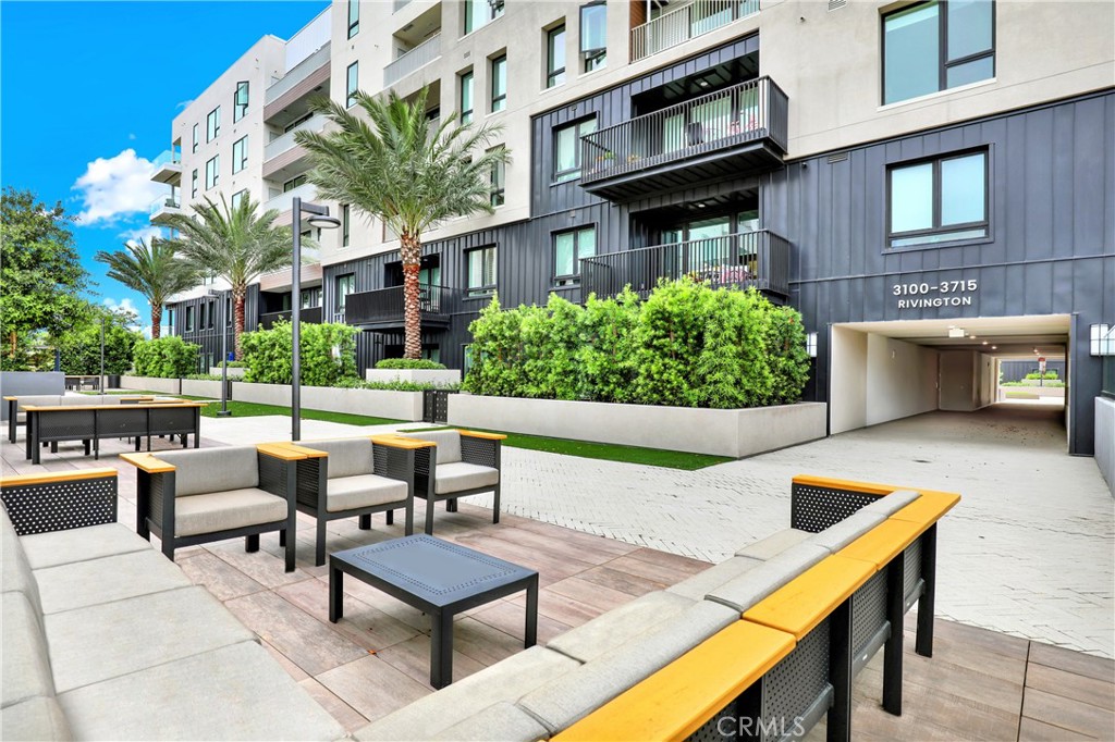 3715 Rivington Irvine, CA 92612 - Photo 59 of 65 a view of a patio with couches table and chairs potted plants