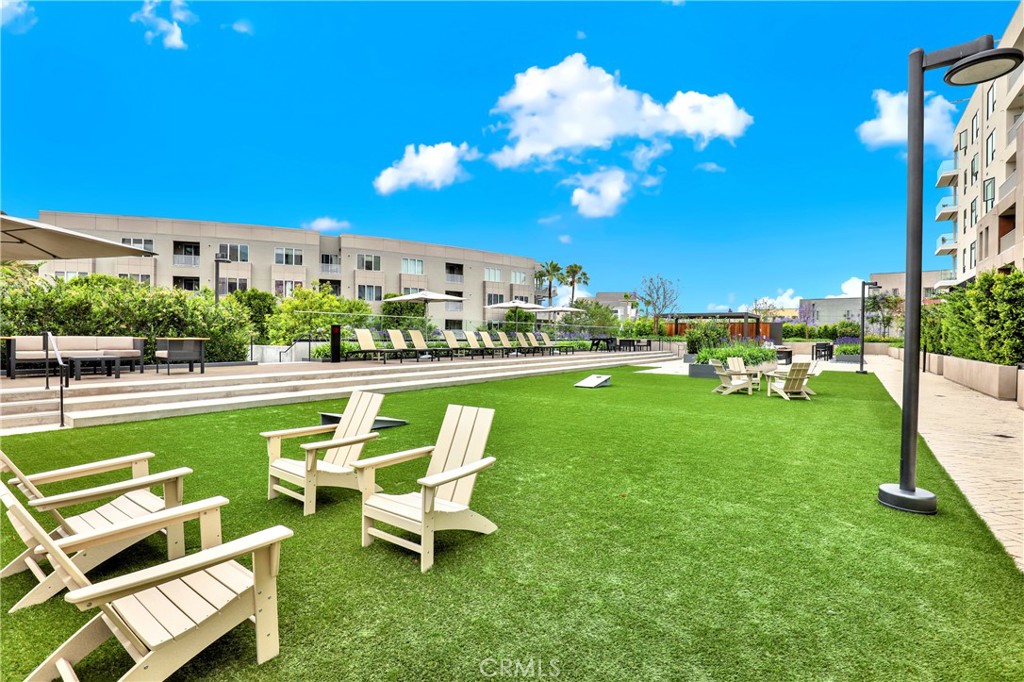 3715 Rivington Irvine, CA 92612 - Photo 61 of 65 a view of a swimming pool and lounge chairs