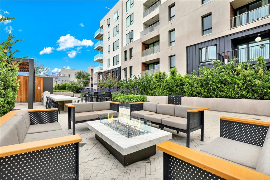 3715 Rivington Irvine, CA 92612 - Photo 62 of 65 a view of a patio with couches and potted plants