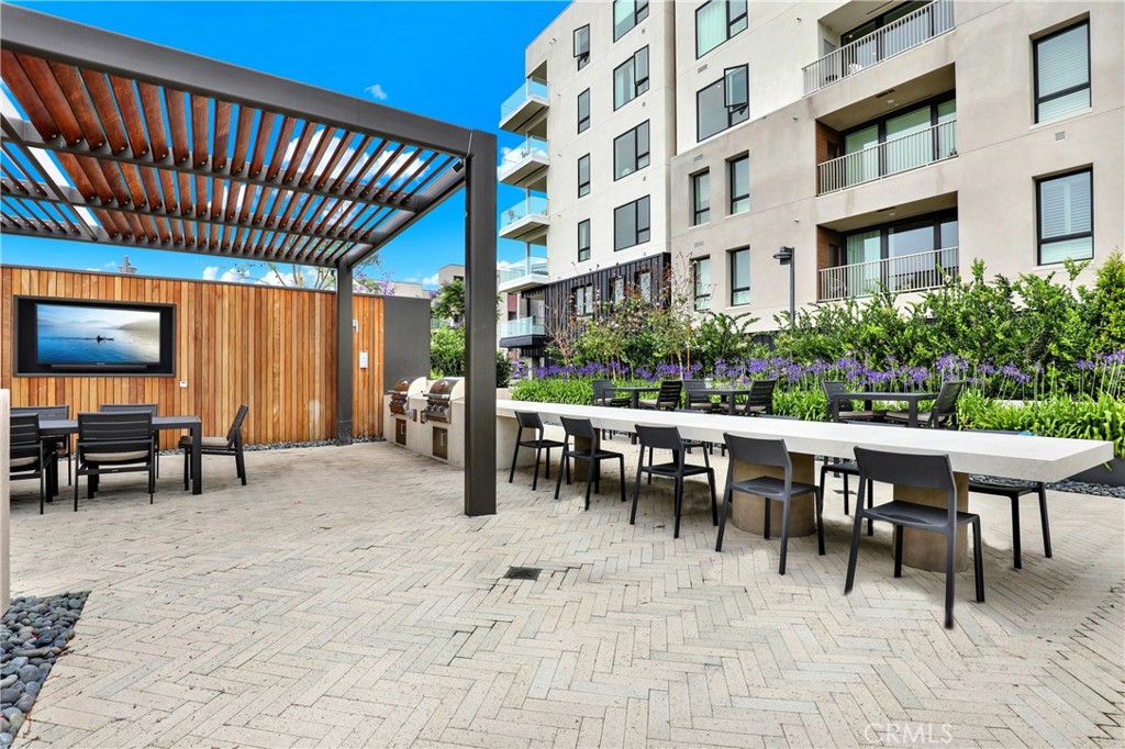 3715 Rivington Irvine, CA 92612 - Photo 63 of 65 a view of a patio with a table and chairs
