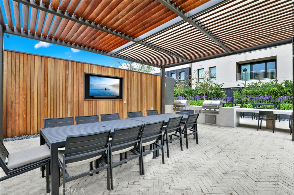 3715 Rivington Irvine, CA 92612 - Photo 64 of 65 a patio with a table and chairs