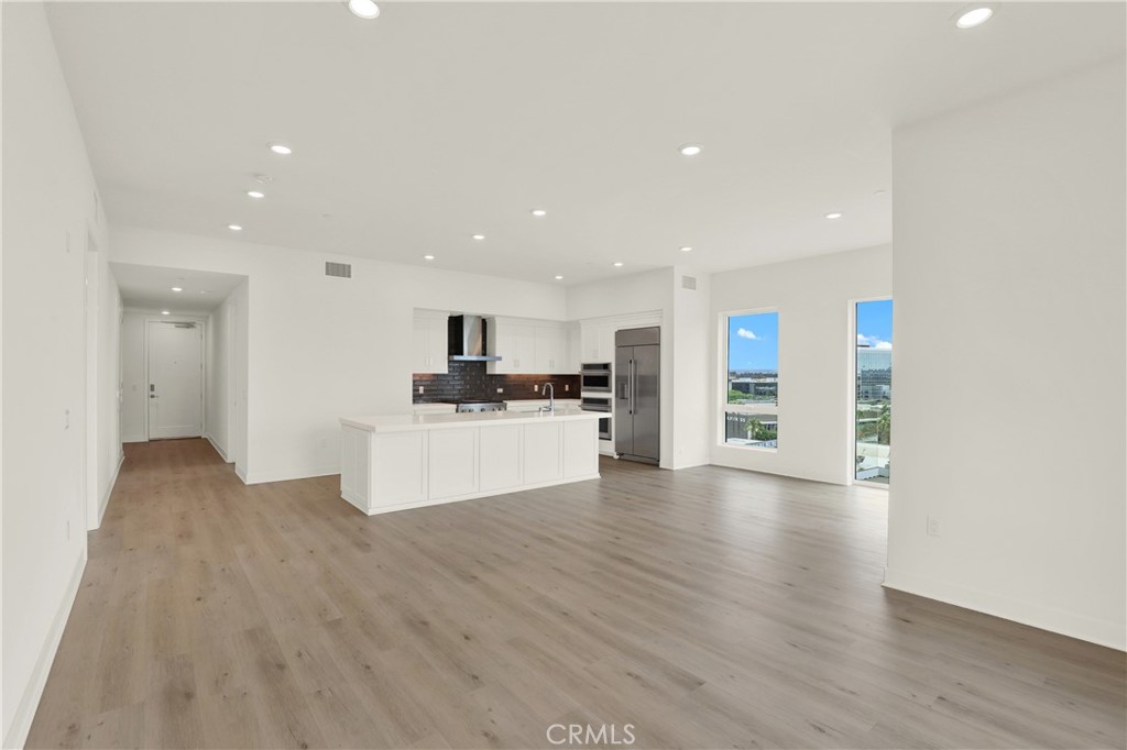 3715 Rivington Irvine, CA 92612 - Photo 9 of 65 a view of kitchen with kitchen island white cabinets and refrigerator