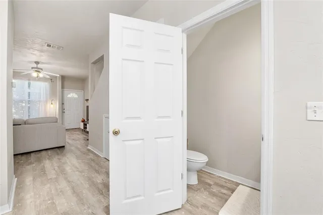 a bathroom with a tub and a toilet