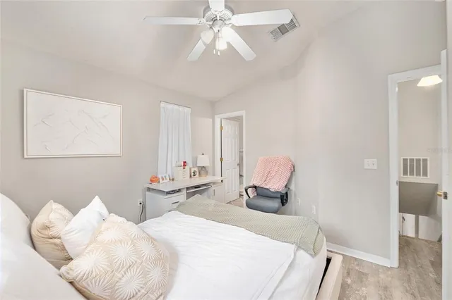 a bedroom with furniture and a chandelier