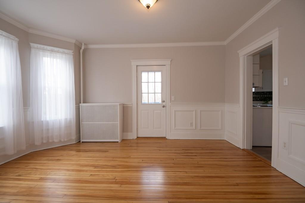 11 Wrentham Road Worcester, MA 01602 - Photo 13 of 28 an empty room with wooden floor and windows