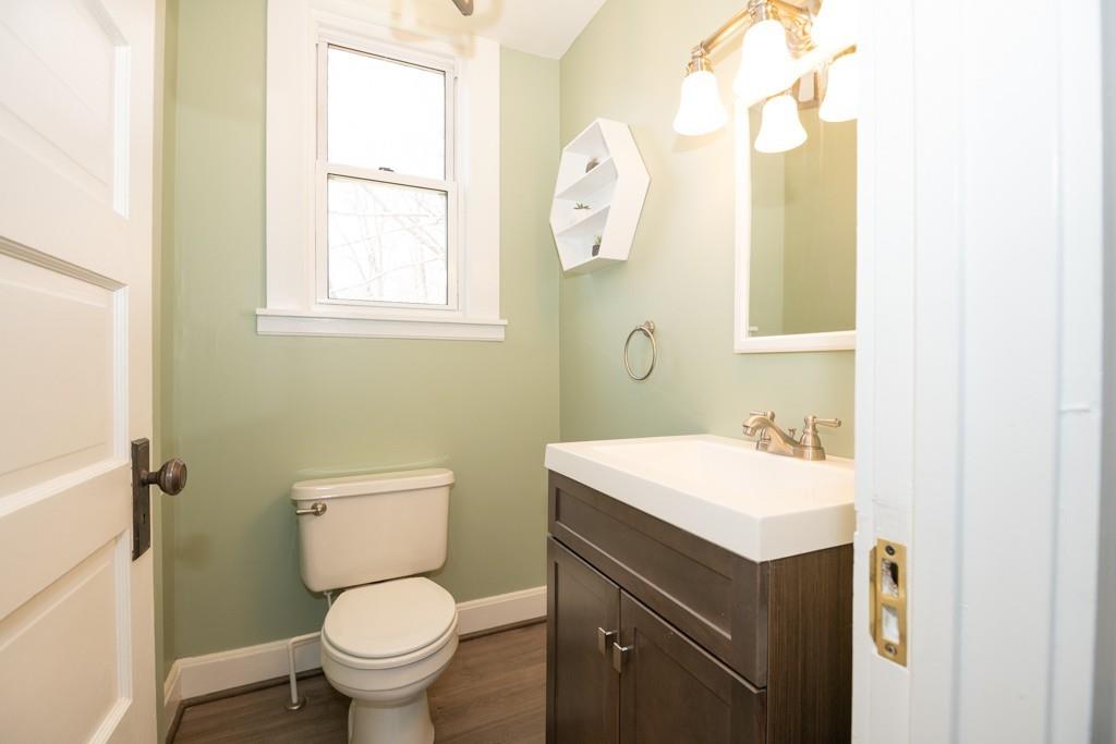 11 Wrentham Road Worcester, MA 01602 - Photo 14 of 28 a bathroom with a toilet sink vanity and mirror