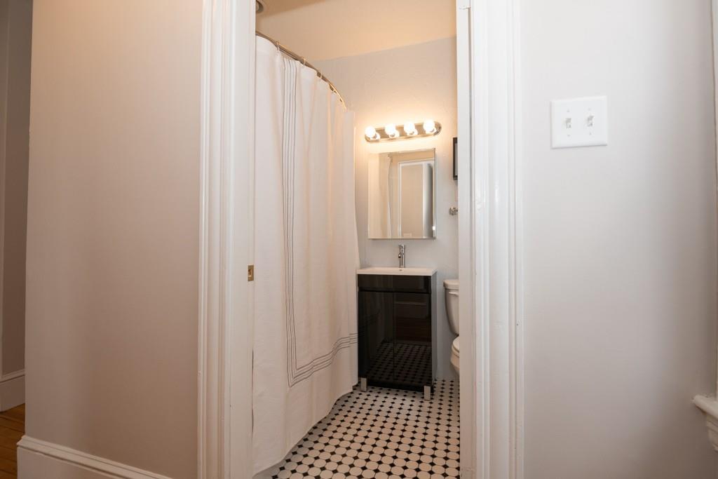 11 Wrentham Road Worcester, MA 01602 - Photo 22 of 28 a bathroom with a sink and a mirror