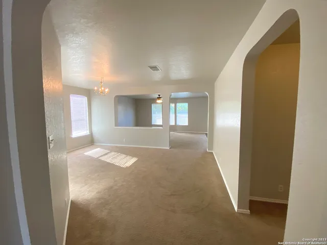 a view of entryway with kitchen