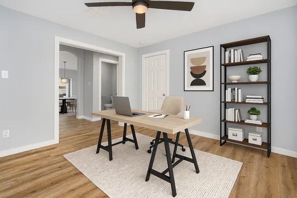 a workspace with furniture and wooden floor