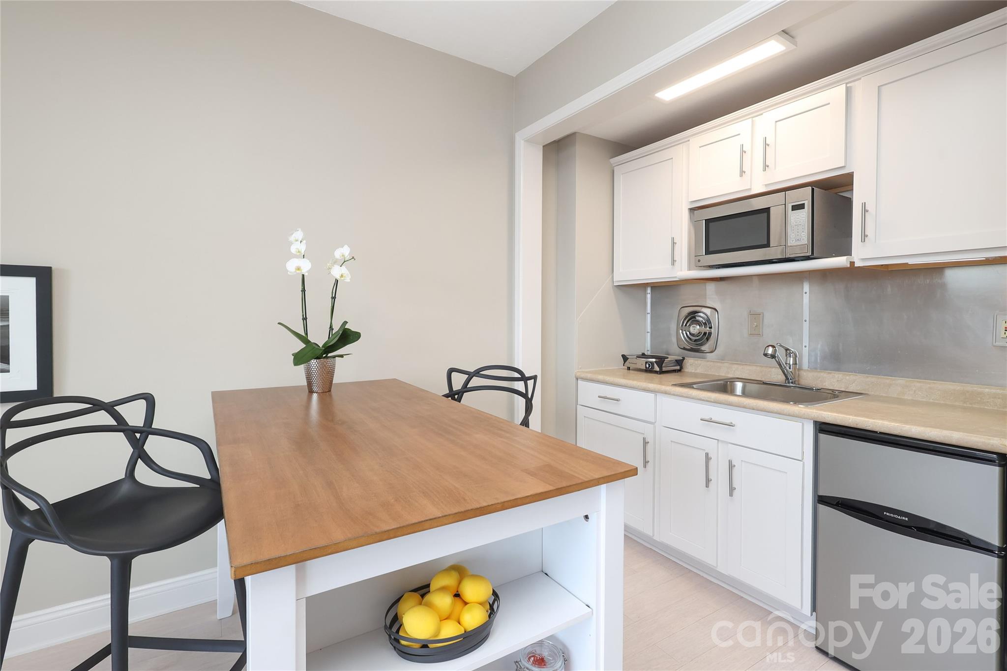 1300 Reece Road, Unit 300 Charlotte, NC 28209 - Photo 11 of 23 a kitchen with stainless steel appliances granite countertop a sink a stove and cabinets