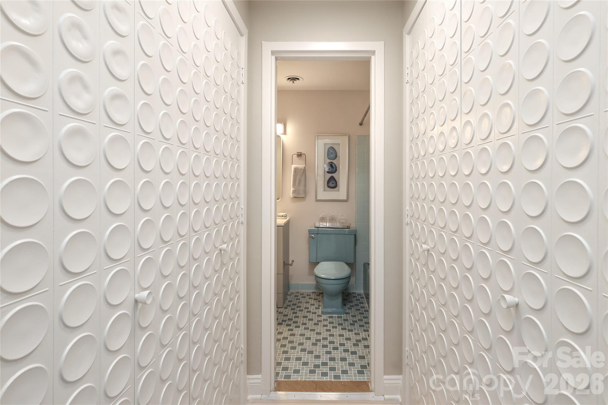 1300 Reece Road, Unit 300 Charlotte, NC 28209 - Photo 13 of 23 a bathroom with a toilet and a shower curtain