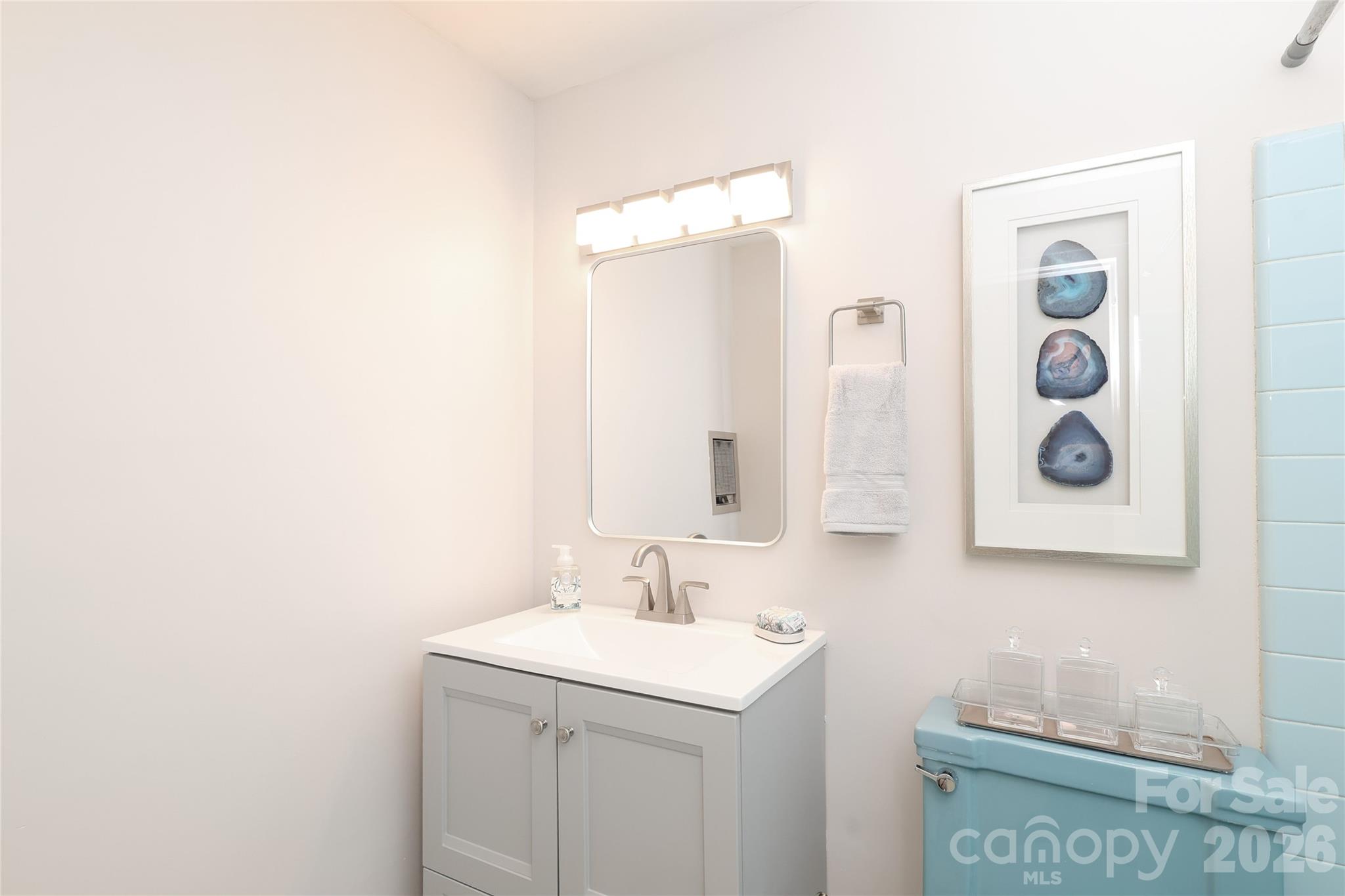 1300 Reece Road, Unit 300 Charlotte, NC 28209 - Photo 14 of 23 a bathroom with a sink and a mirror