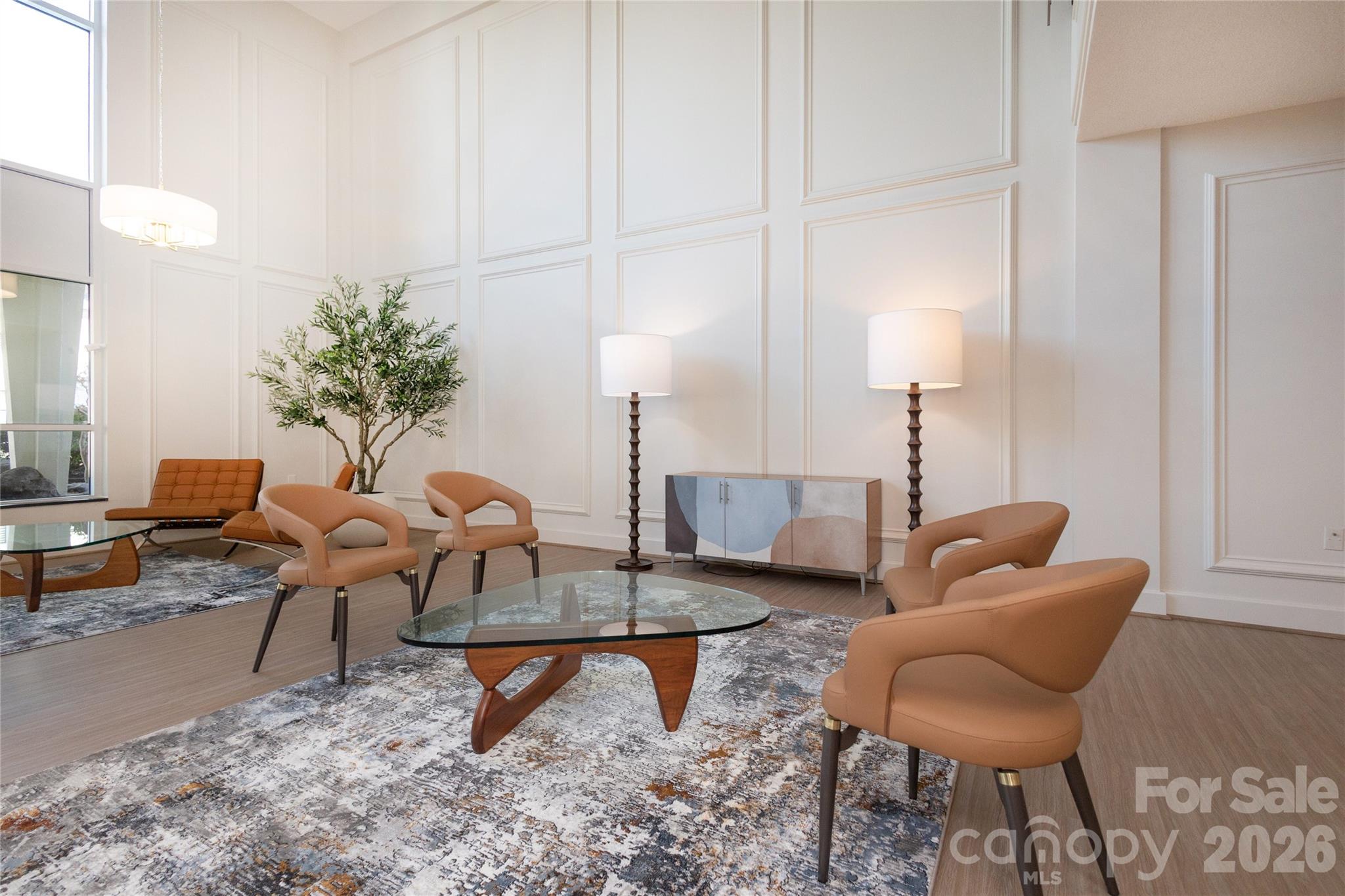 1300 Reece Road, Unit 300 Charlotte, NC 28209 - Photo 16 of 23 a living room with furniture and a lamp